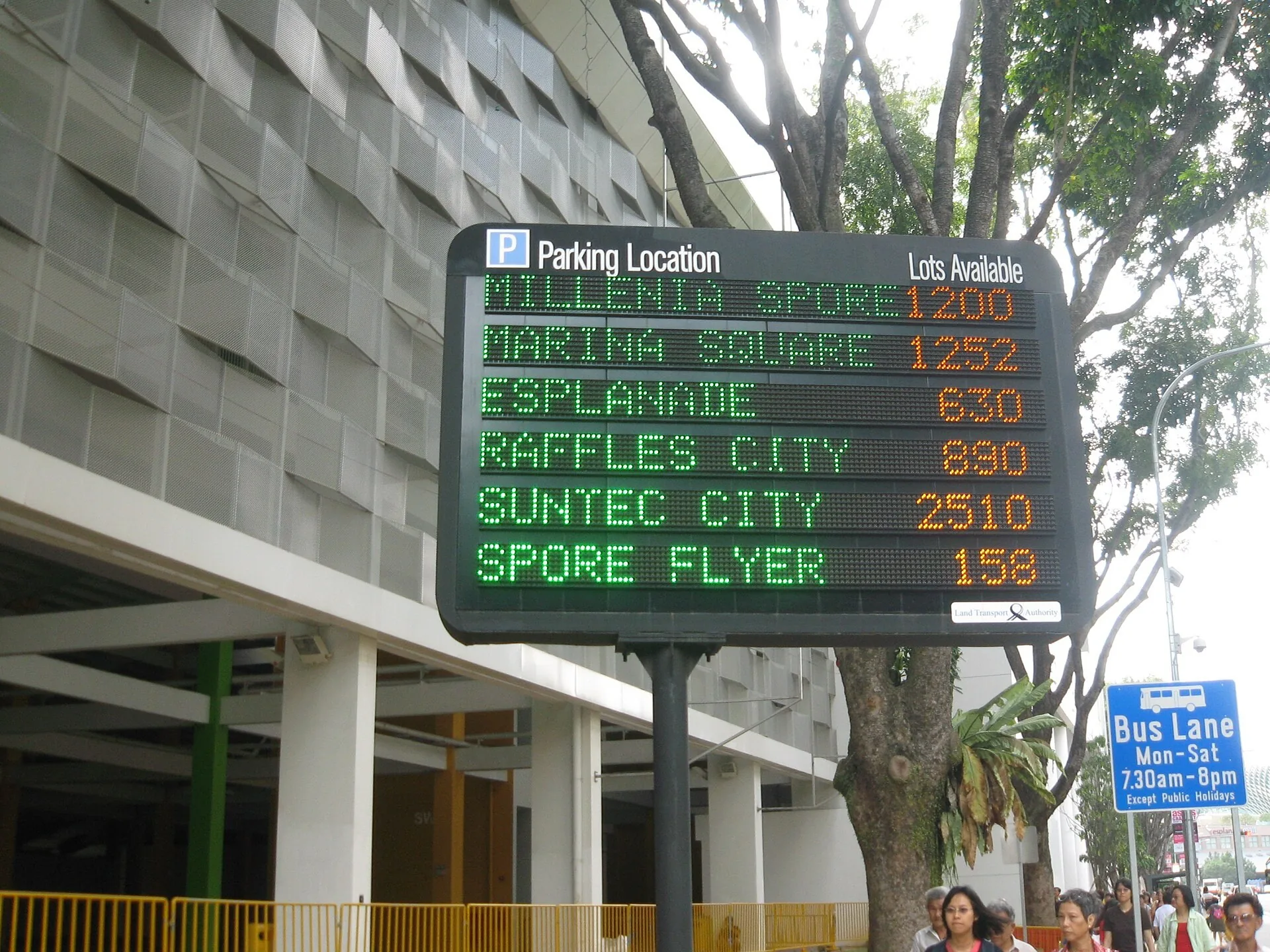 Directional and regulatory signage mounted above a roadway