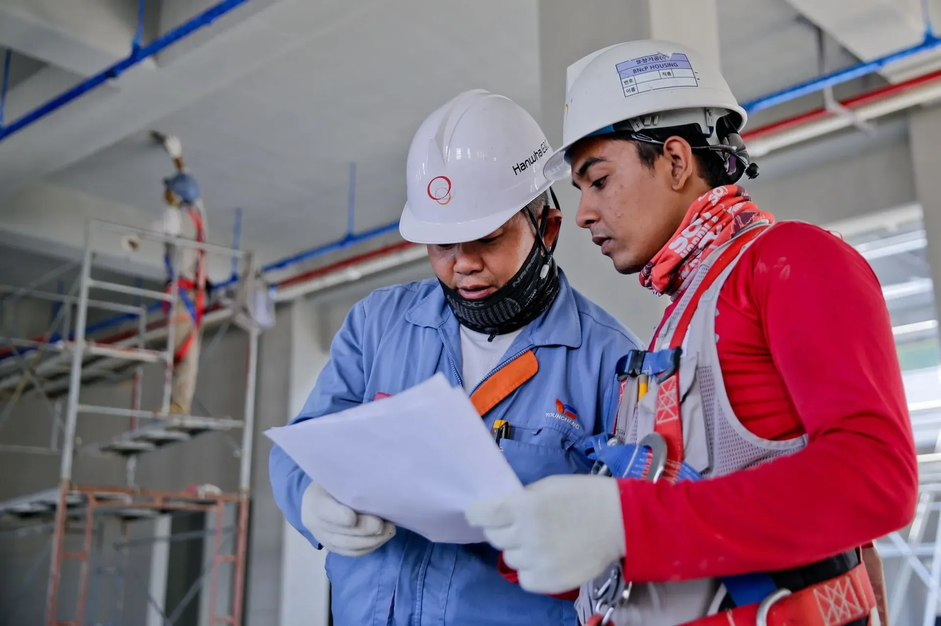Engineer verifying installed systems before handover